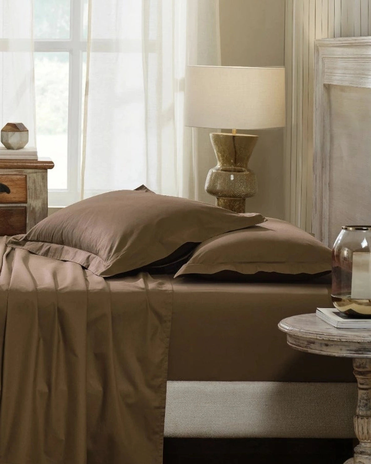 Baked Clay 400TC percale king pillow cover set with flange, side view on a made bed
