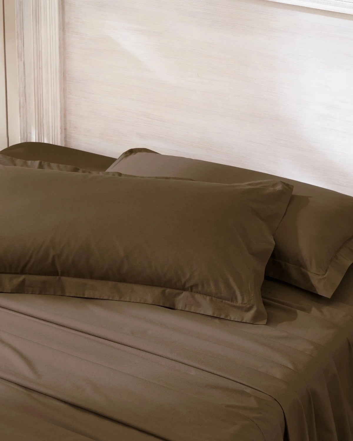 Baked Clay 400TC percale king pillow cover set with flange, top view on a made bed