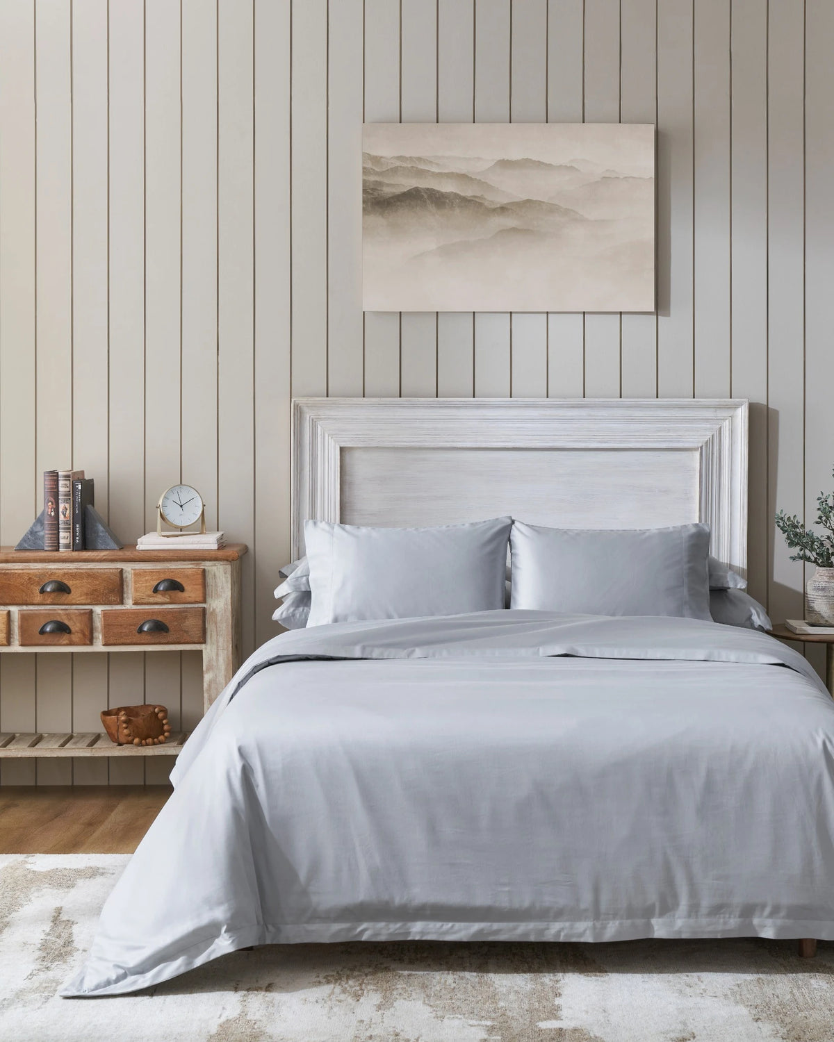 Cool Grey 600TC sateen duvet cover with flange, front view on a made bed