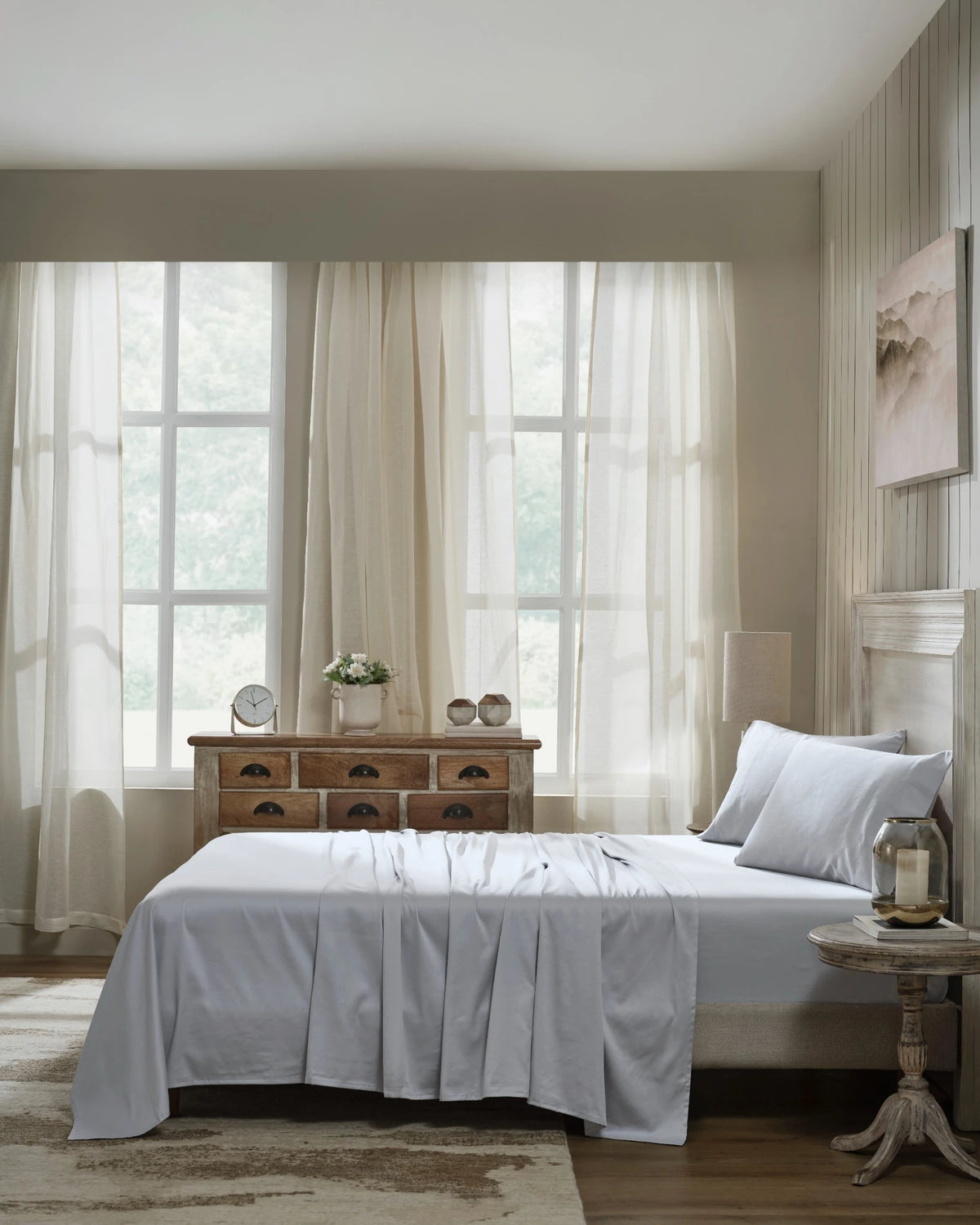 Cool Grey 600TC sateen fitted sheet set with standard pillowcases, side view on a made bed