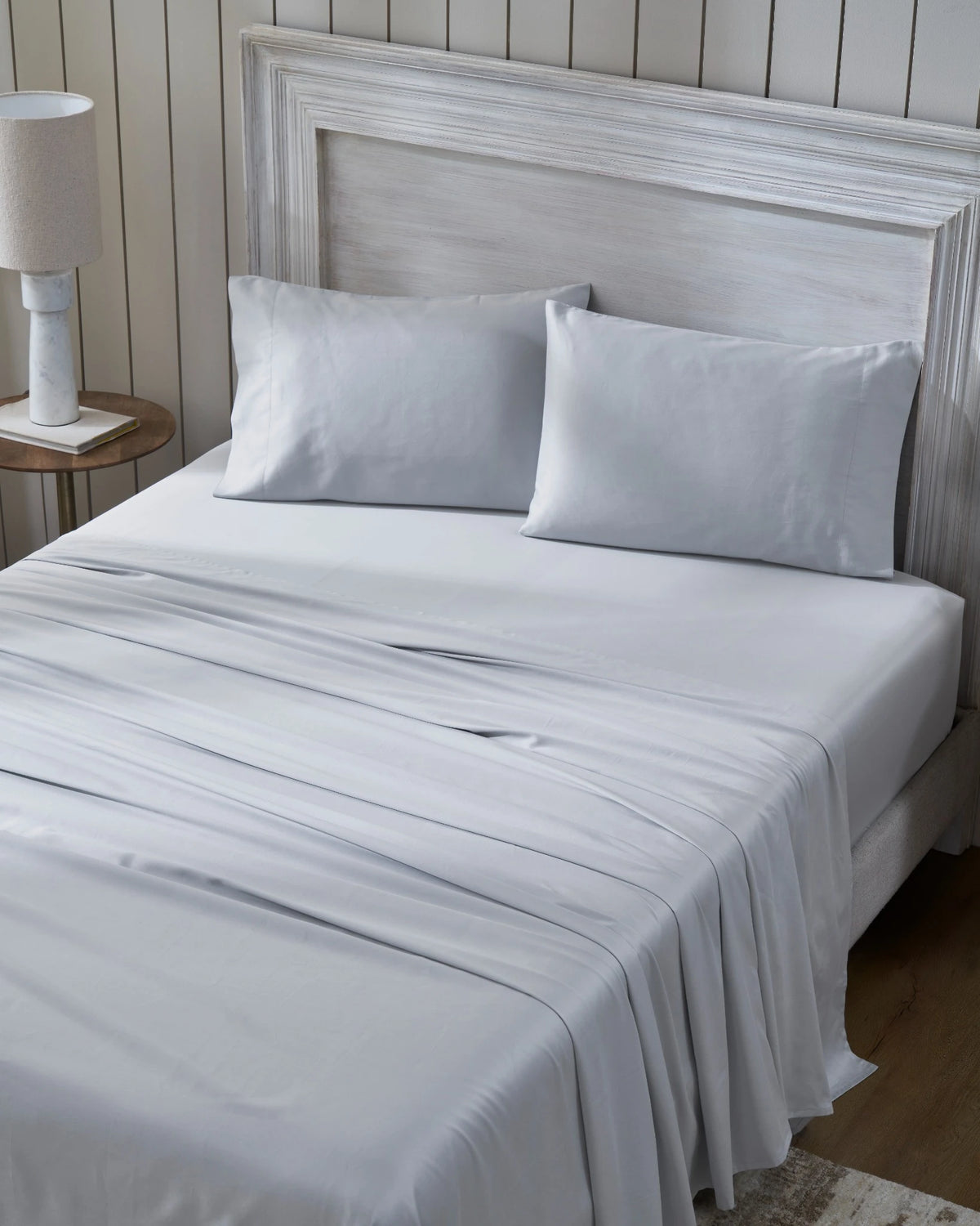 Cool Grey 600TC sateen flat sheet set with standard pillowcases, top view on a made bed