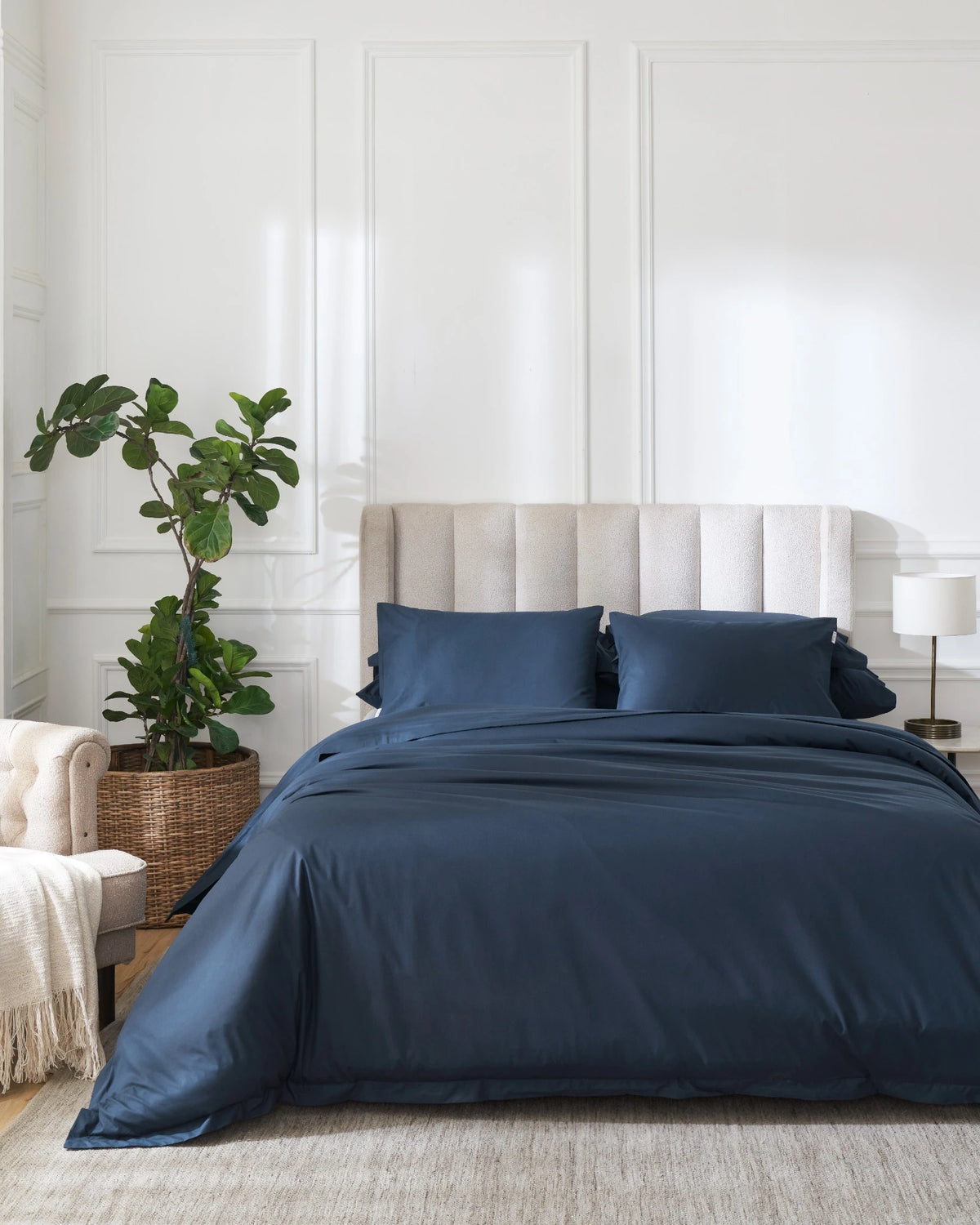 Dress Blue 400TC percale duvet cover with flange, front view on a made bed