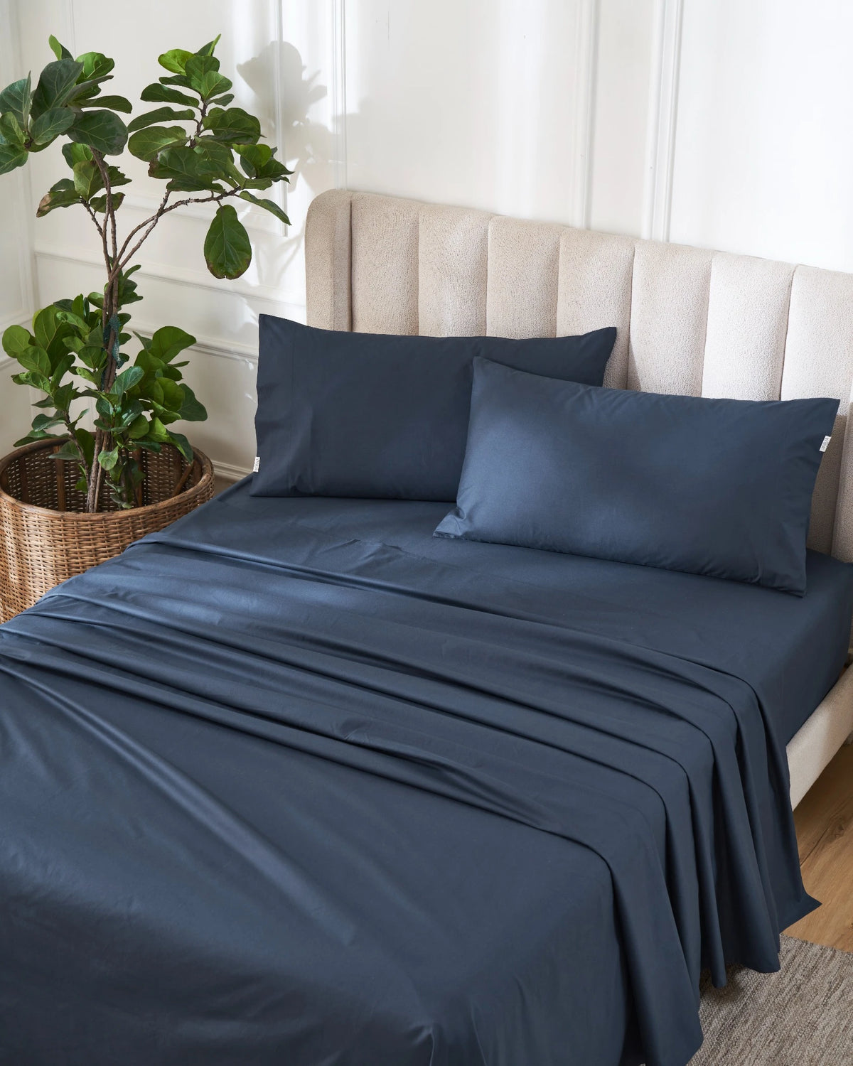 Dress Blue 400TC percale flat sheet set with king pillowcases, top view on a made bed