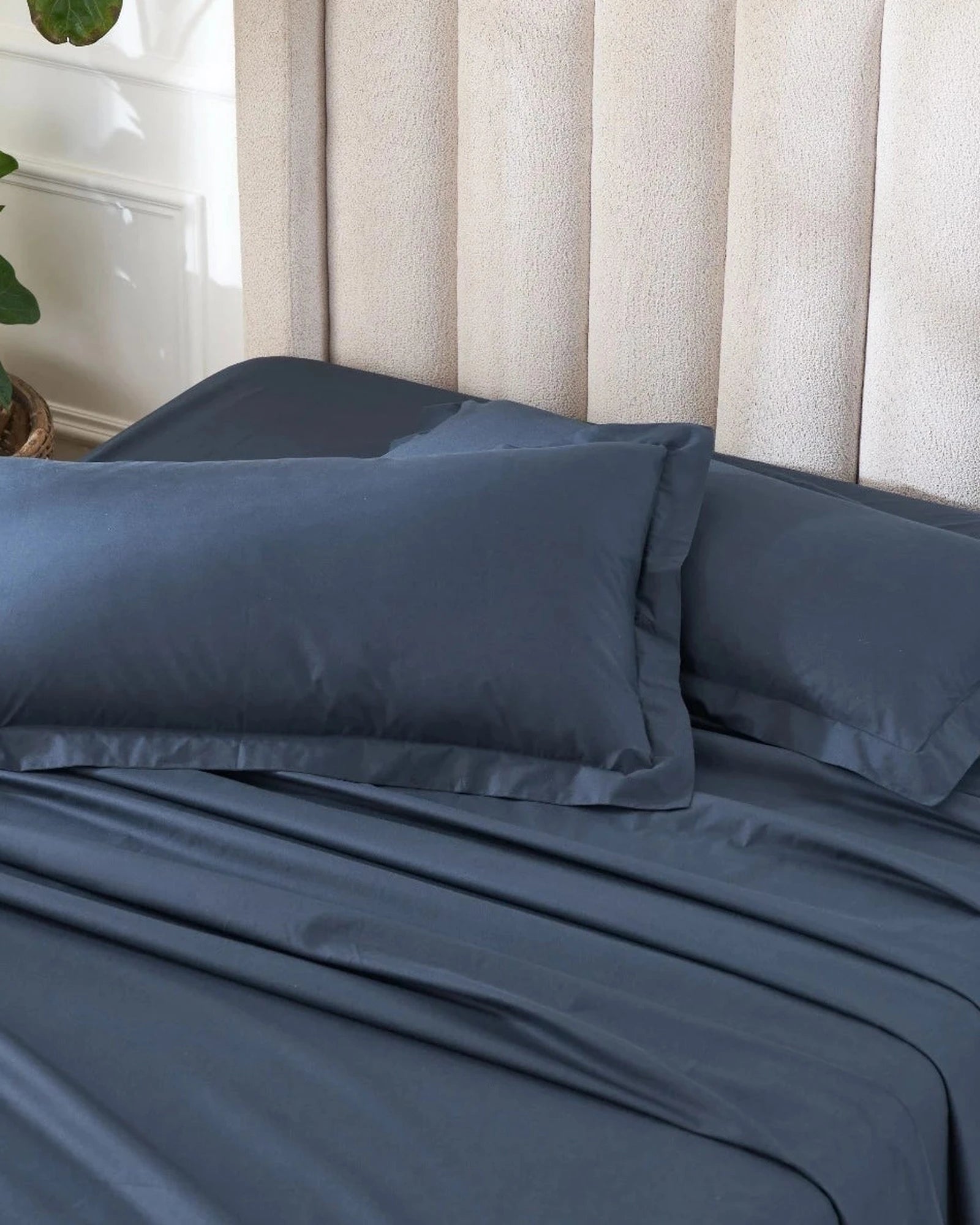 Dress Blue 400TC percale king pillow cover set with flange, top view on a made bed