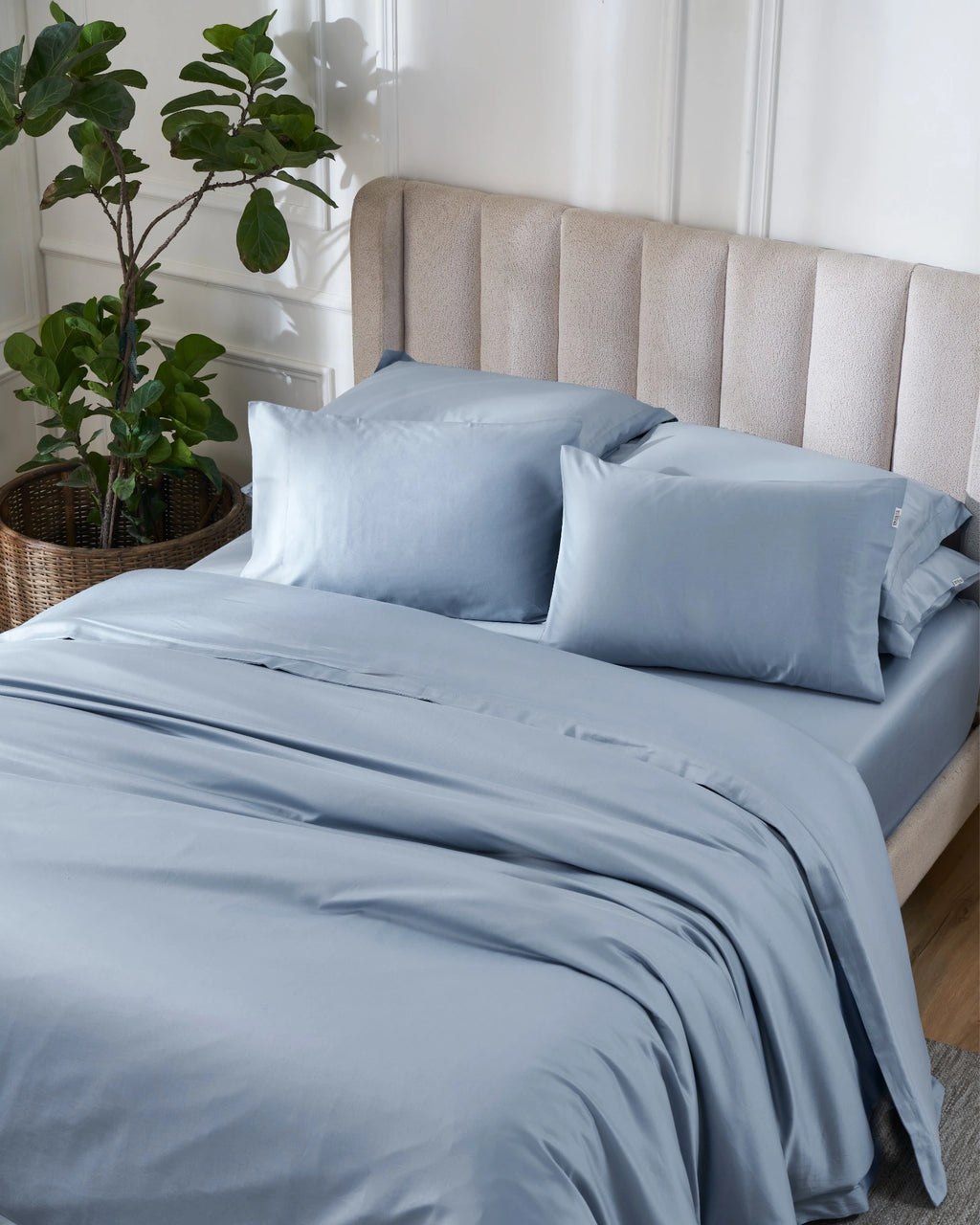 Dusty Blue 600TC sateen duvet cover with flange, top view on a made bed