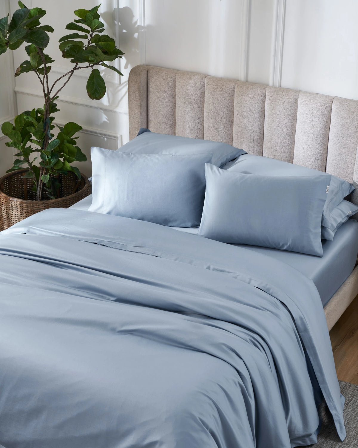 Dusty Blue 600TC sateen duvet cover with flange, top view on a made bed