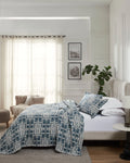 Glacier Blue Modern Geo 100% cotton bedspread set with standard pillow covers, side view on a made bed