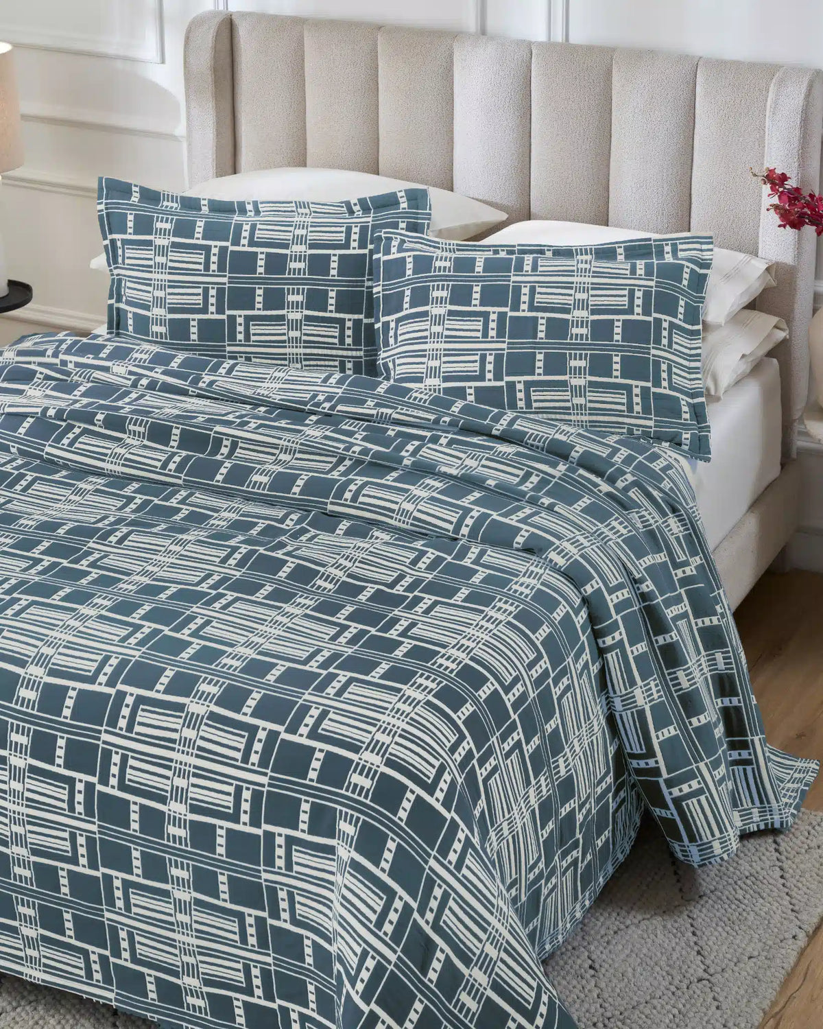 Glacier Blue Modern Geo 100% cotton bedspread set with standard pillow covers, top view on a made bed