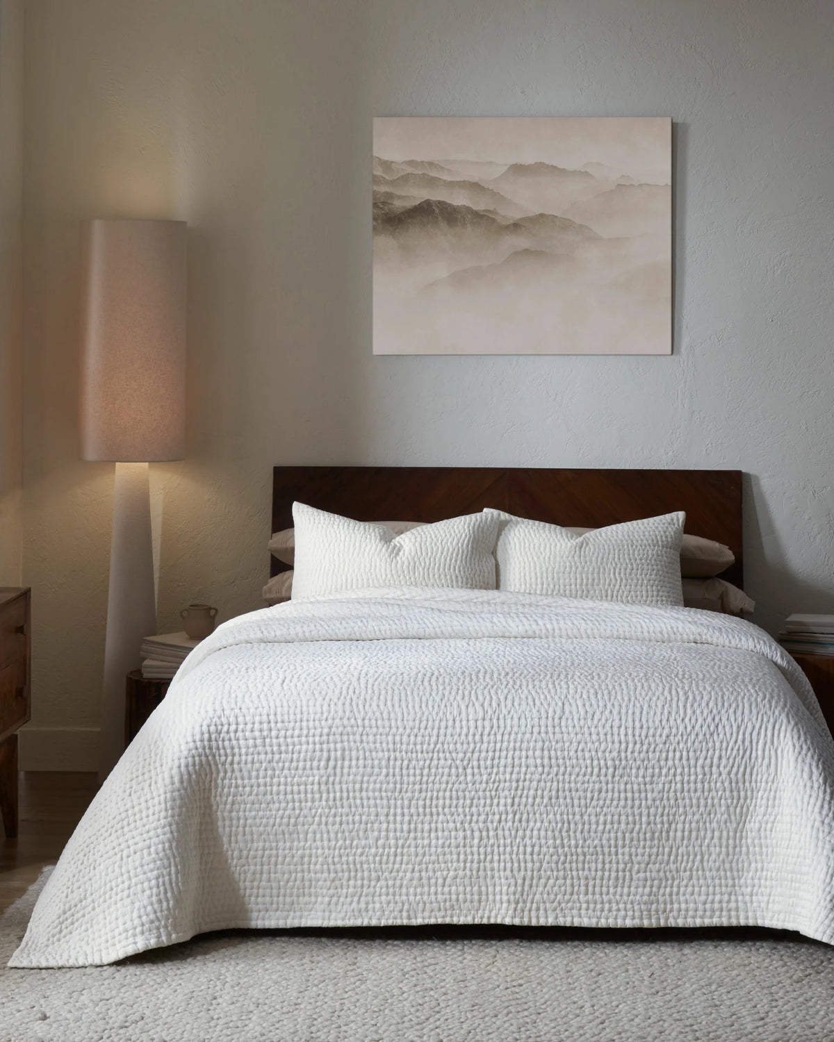 Ivory habutai silk hand-quilted quilt set with standard pillowcases, front view on a made bed