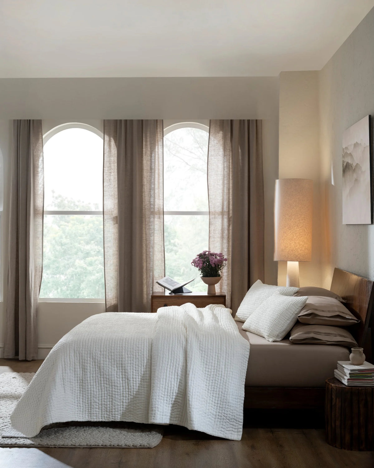 Ivory habutai silk hand-quilted quilt set with standard pillowcases, side view on a made bed