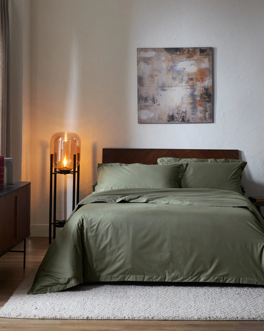 Ivy Green 400TC percale duvet cover with flange, front view on a made bed