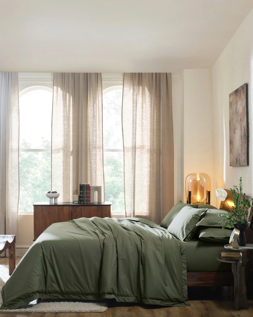 Ivy Green 400TC percale duvet cover with flange, side view on a made bed