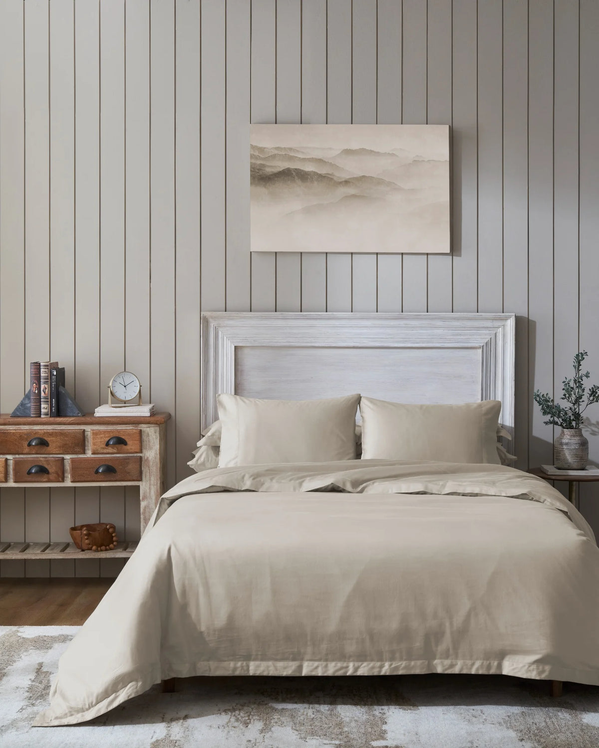 Oatmilk 600TC sateen duvet cover with flange, front view on a made bed