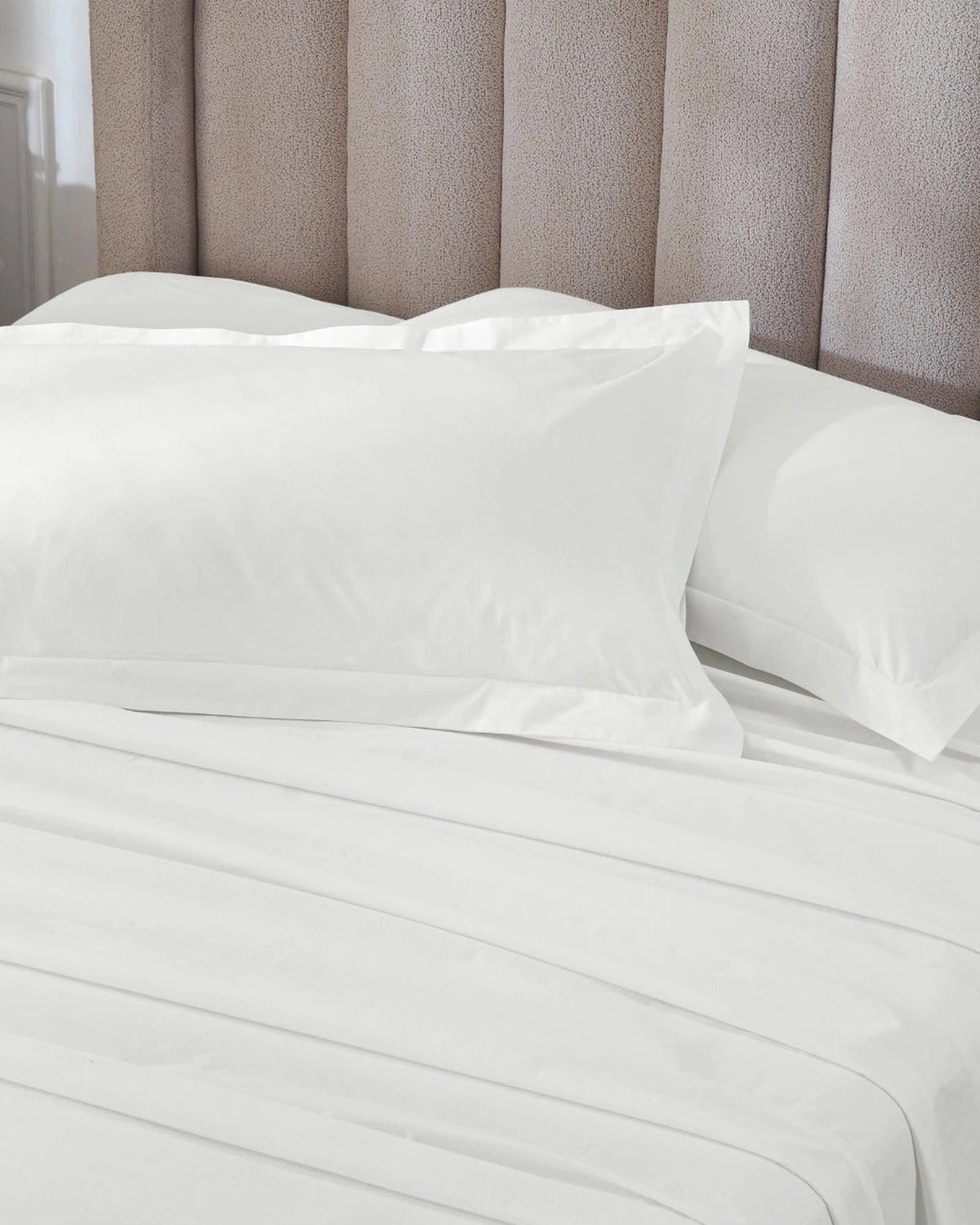 Optic White 400TC percale king pillow cover set with flange, top view on a made bed