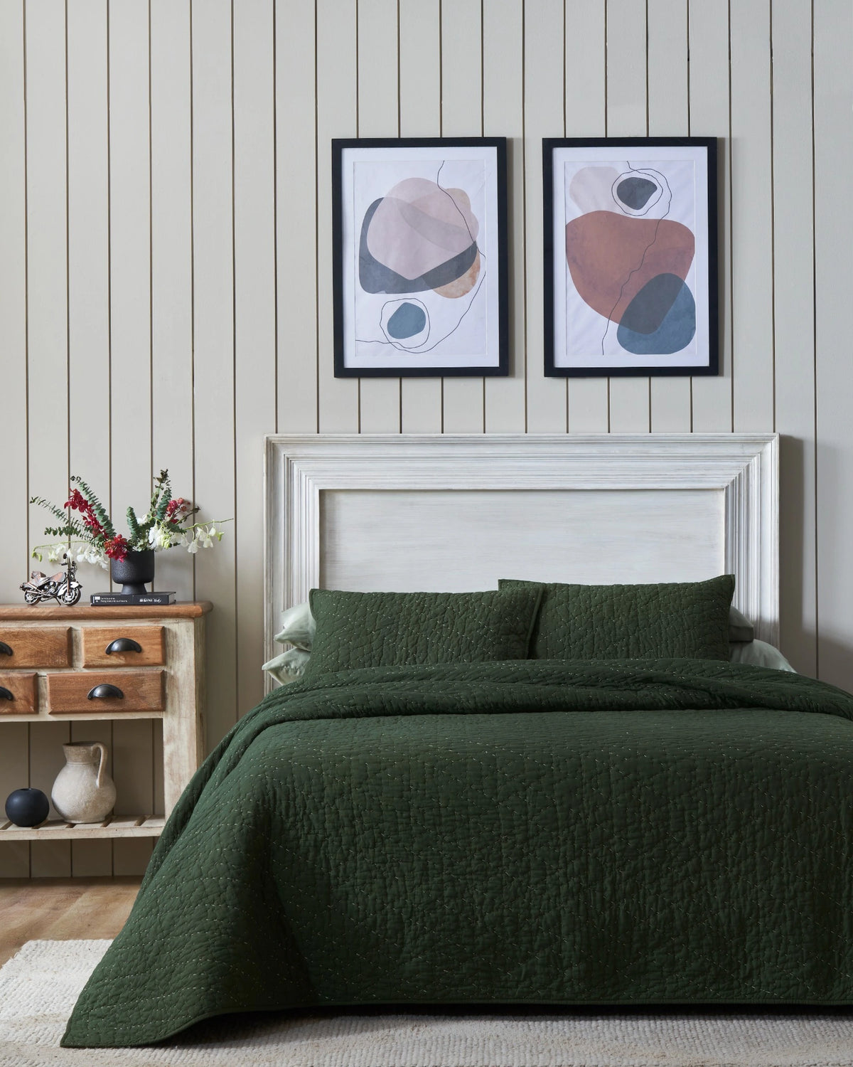 Pine organic tri-color stitch hand quilt set with standard pillowcases, front view on a made bed