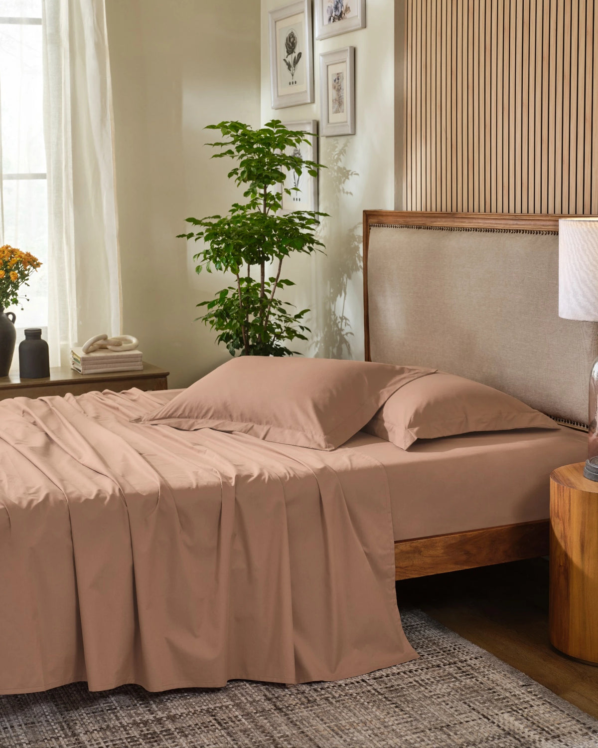 Sandalwood 400TC percale standard pillow cover set with flange, side view on a made bed