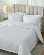 Tofu 1000TC sateen duvet cover with flange, top view on a made bed