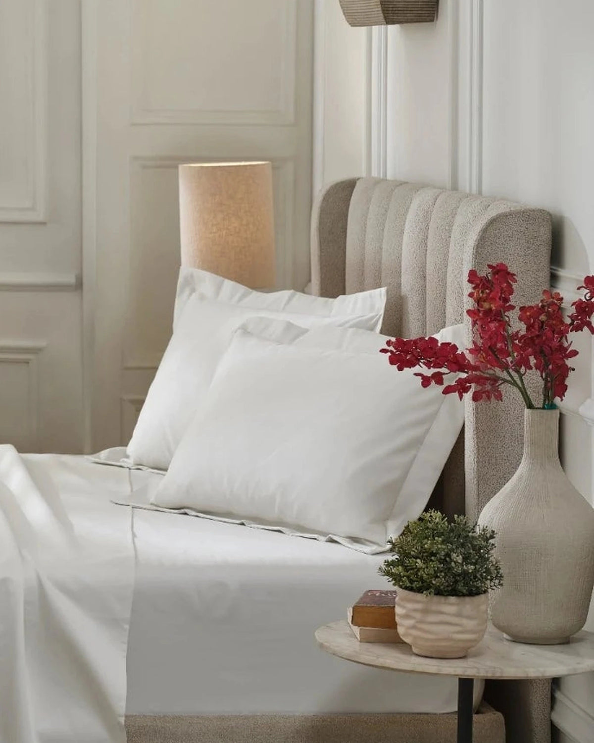 Tofu 1000TC sateen standard pillow cover set with flange, side view on a made bed
