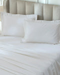 Tofu 1000TC sateen standard pillow cover set with flange, top view on a made bed