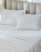 Tofu 1000TC sateen standard pillow cover set with flange, top view on a made bed