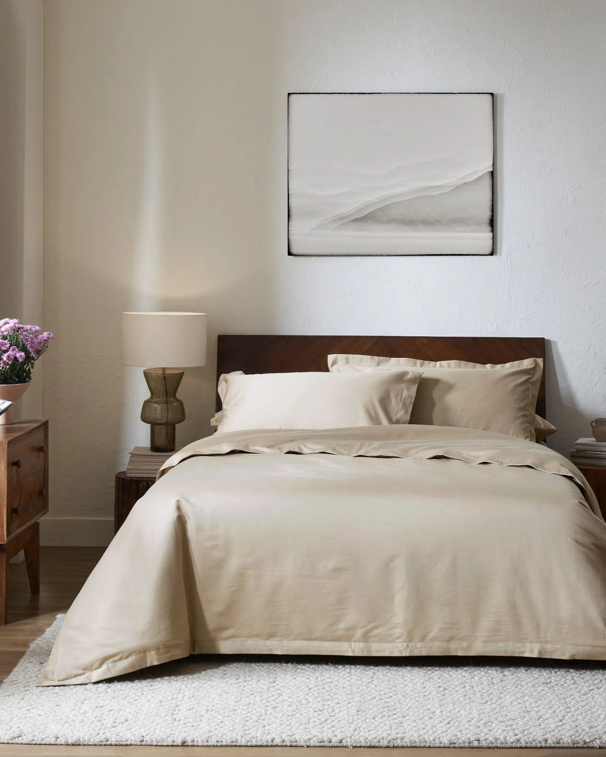 Travertine 1000TC sateen duvet cover with flange, front view on a made bed