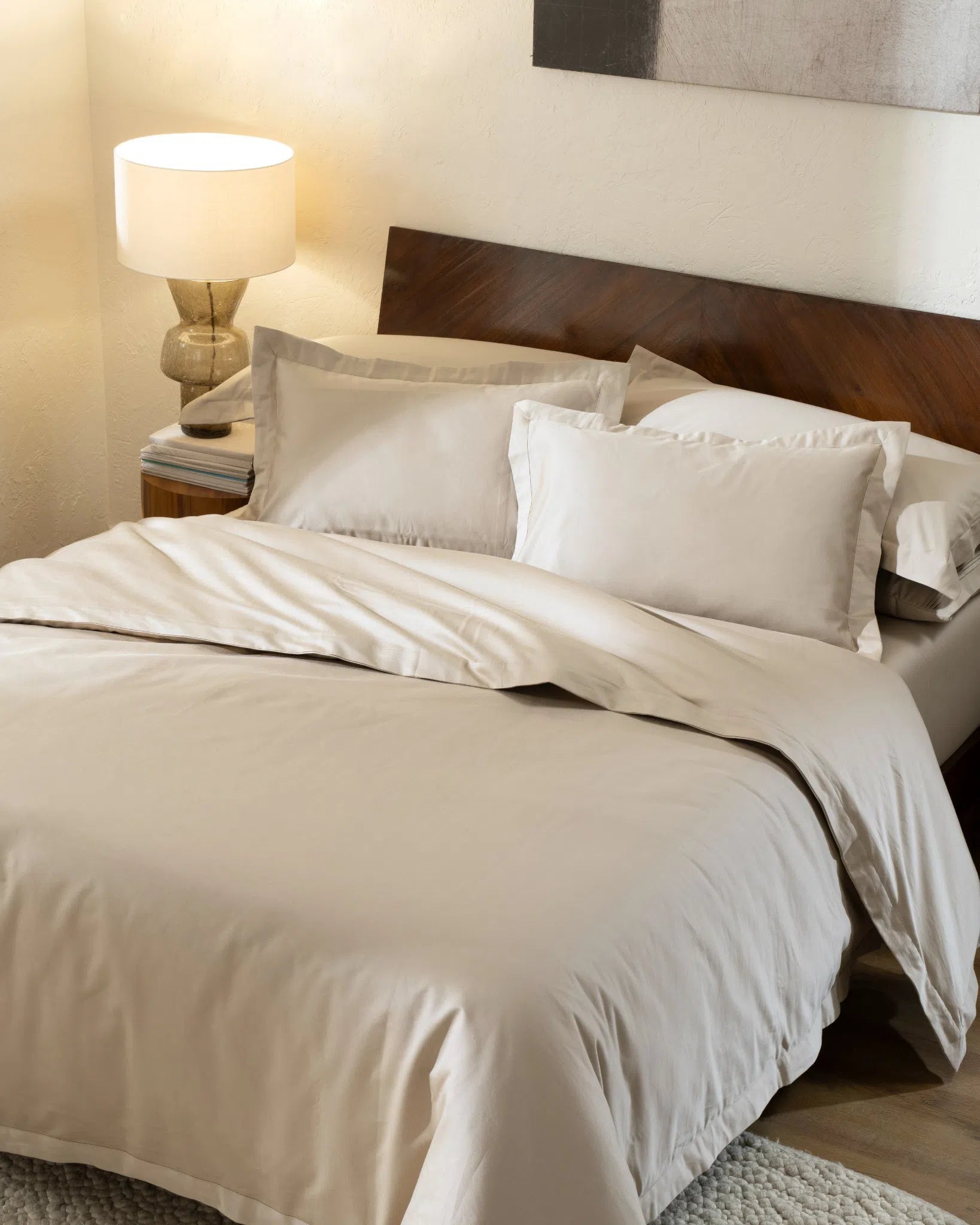 Travertine 1000TC sateen duvet cover with flange, top view on a made bed