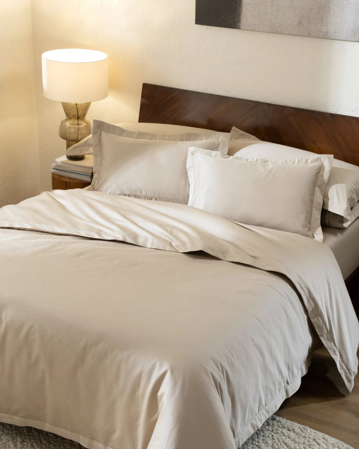 Travertine 1000TC sateen duvet cover with flange, top view on a made bed