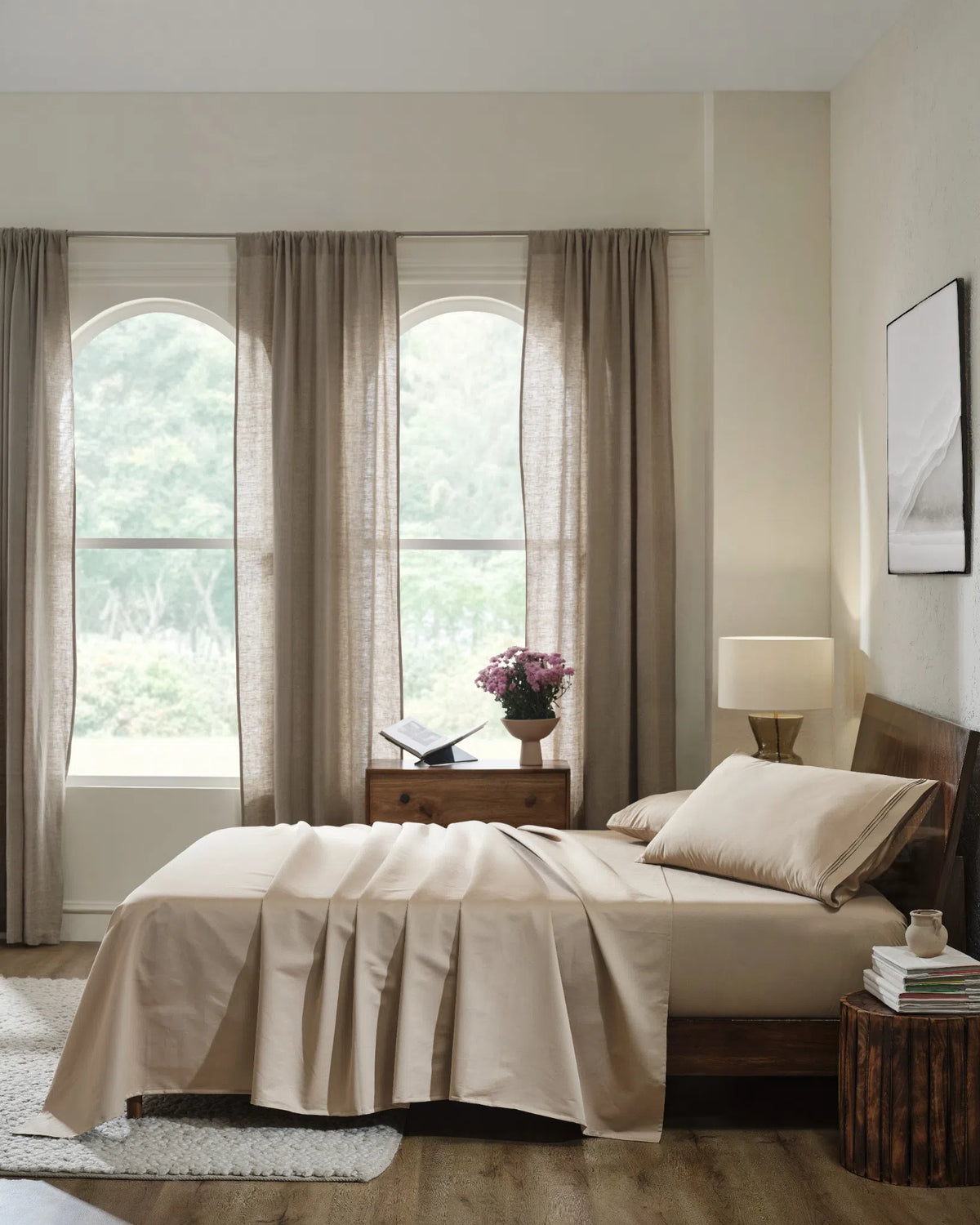 Travertine 1000TC sateen flat and fitted sheet set with king pillow covers, side view on a made bed