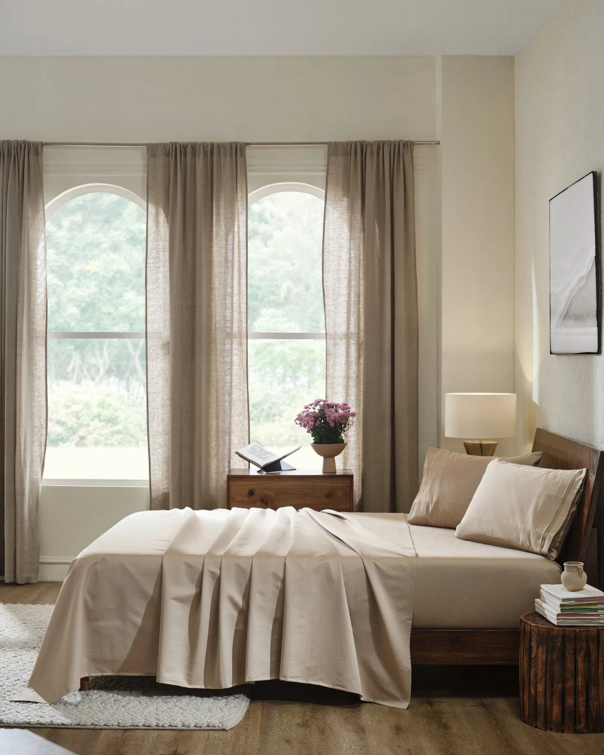 Travertine 1000TC sateen flat and fitted sheet set with standard pillow covers, side view on a made bed