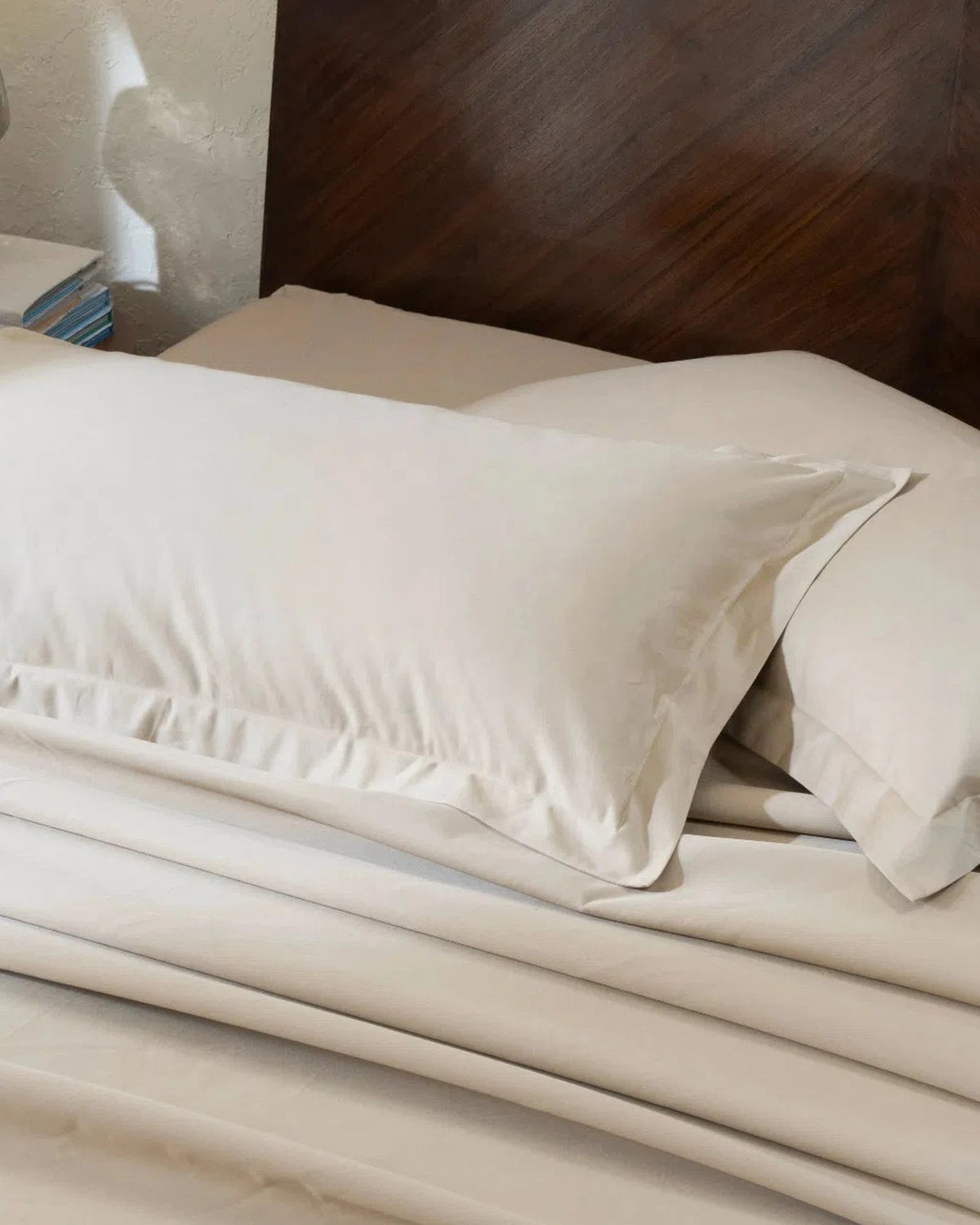 Travertine 1000TC sateen king pillow cover set with flange, top view on a made bed