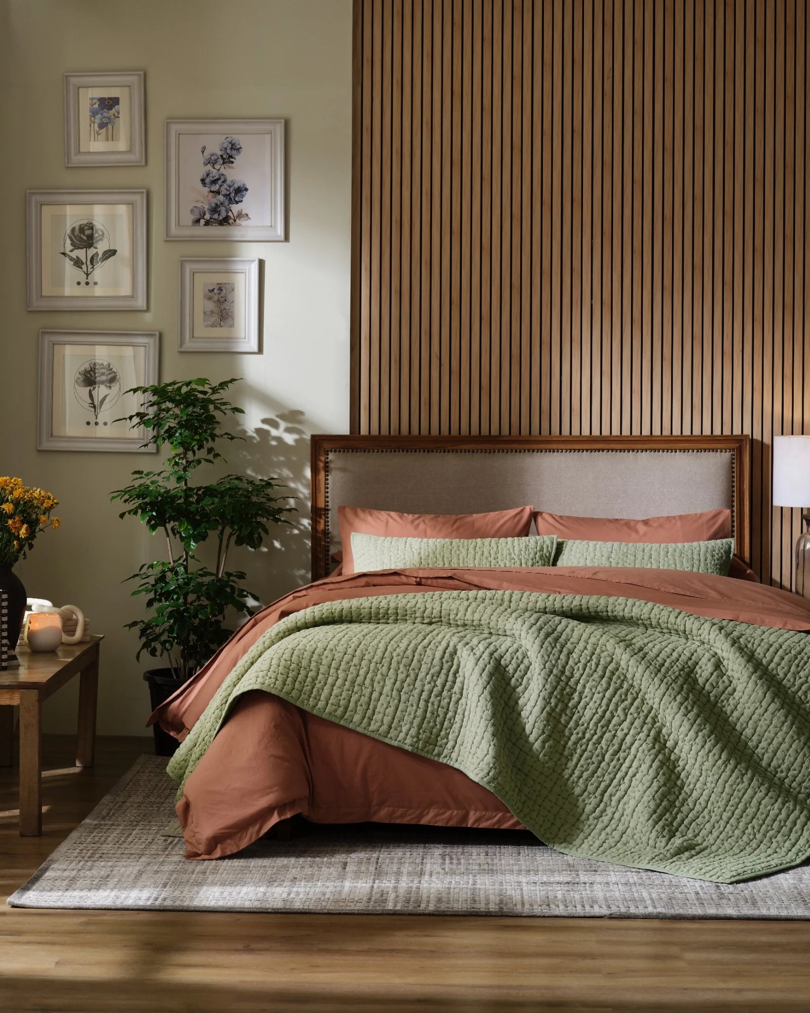Willow Leaf European linen box-stitch hand quilt set with standard pillow covers, front view on a made bed