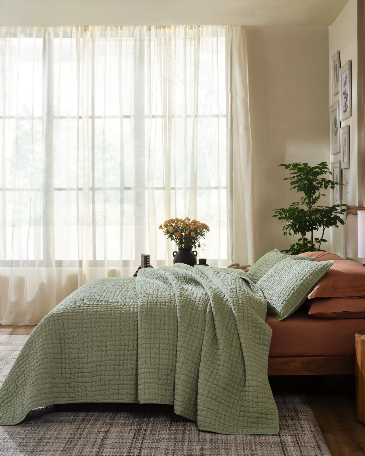 Willow Leaf European linen box-stitch hand quilt set with standard pillowcases, side view on a made bed