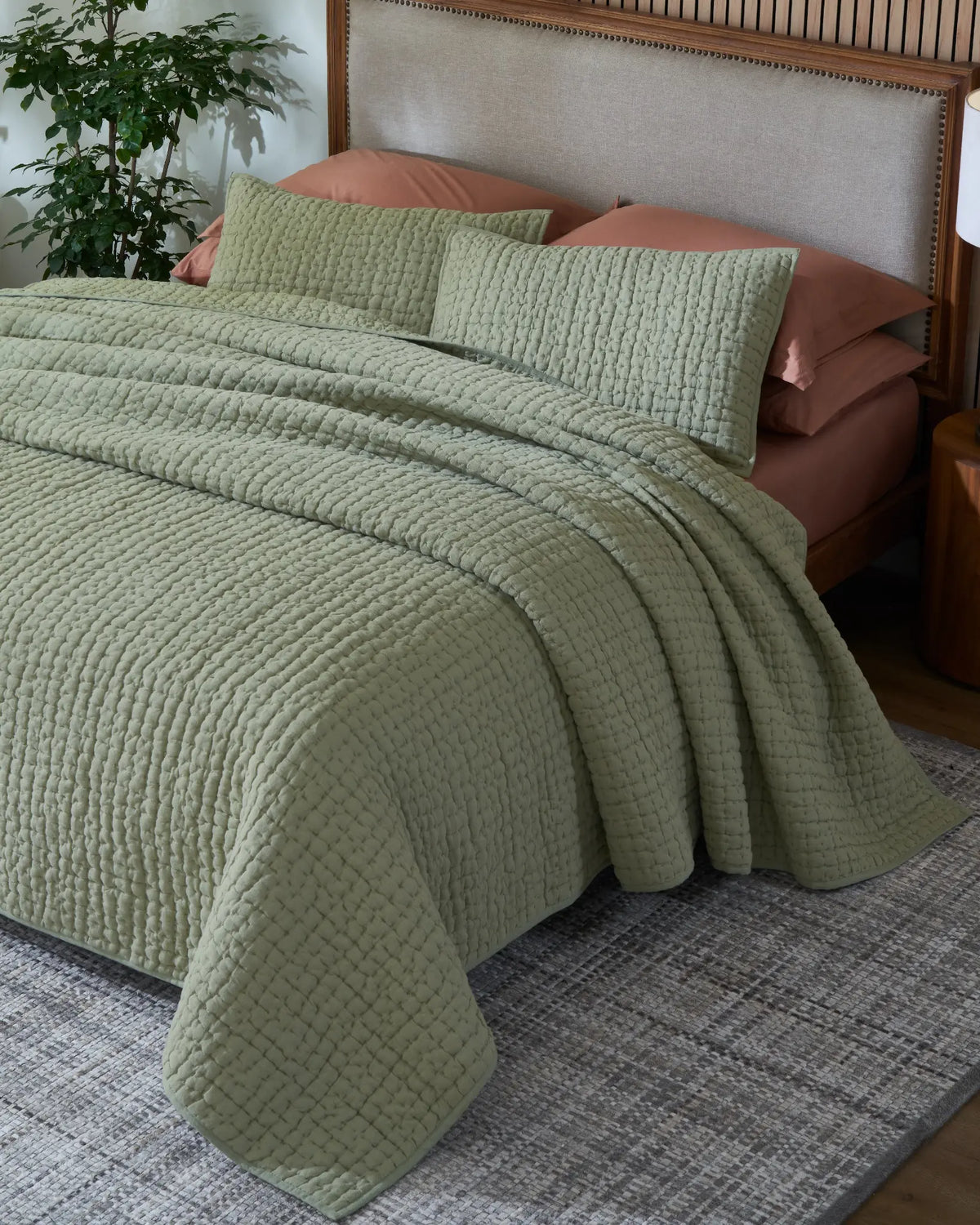 Willow Leaf European linen box-stitch hand quilt set with standard pillow covers, top view on a made bed